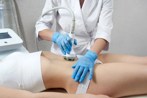 Lost the Weight but Not the Loose Skin? 2 woman having HIFU treatment on her stomach to combat loose skin Market Bosworth following weight loss